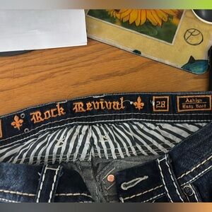 Rock Revival Women’s Dark Blue Jeans
Ashlyn Easy Boot
33” Inseam
18” Opening